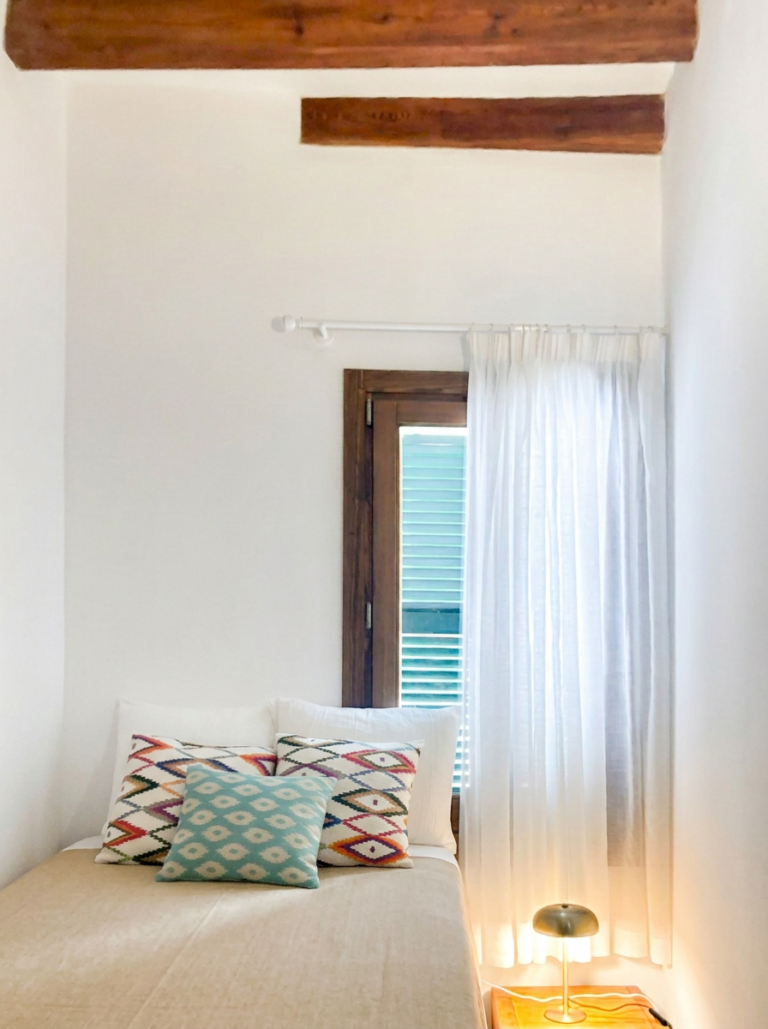 Bedroom with original wooden ceiling beams