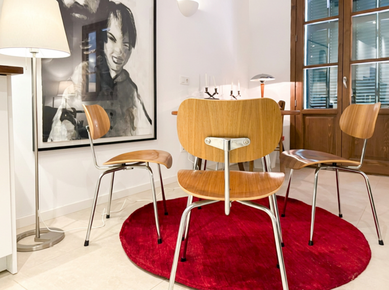 Open dining and sitting area with the red rug
